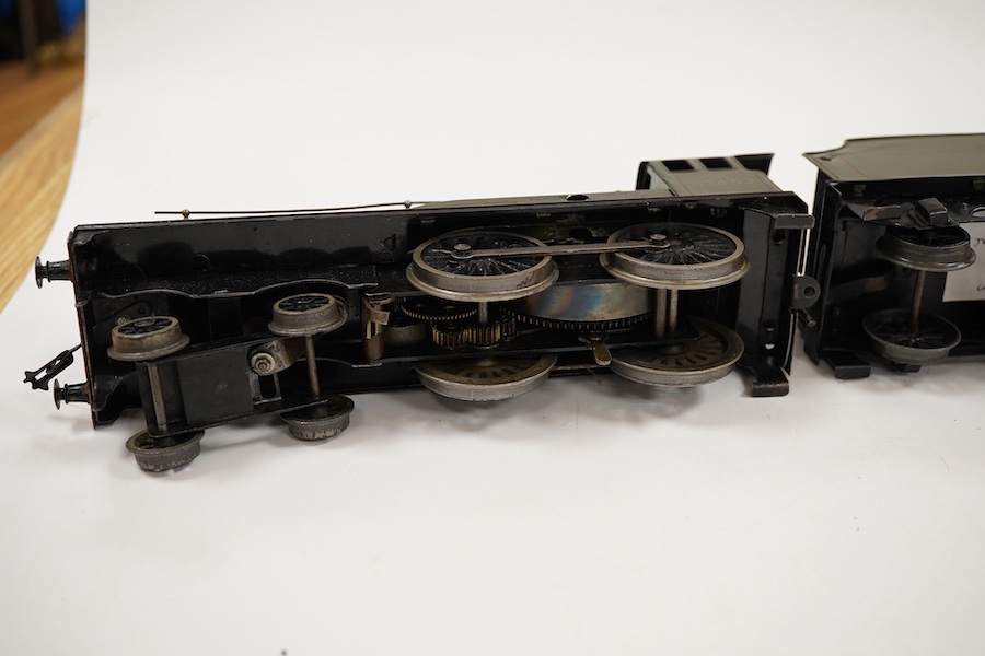 An 0 gauge Bassett-Lowke clockwork tinplate BR 4-4-0 tender locomotive, Prince Charles 62453, in dark green livery with orange and black lining and original clockwork mechanism